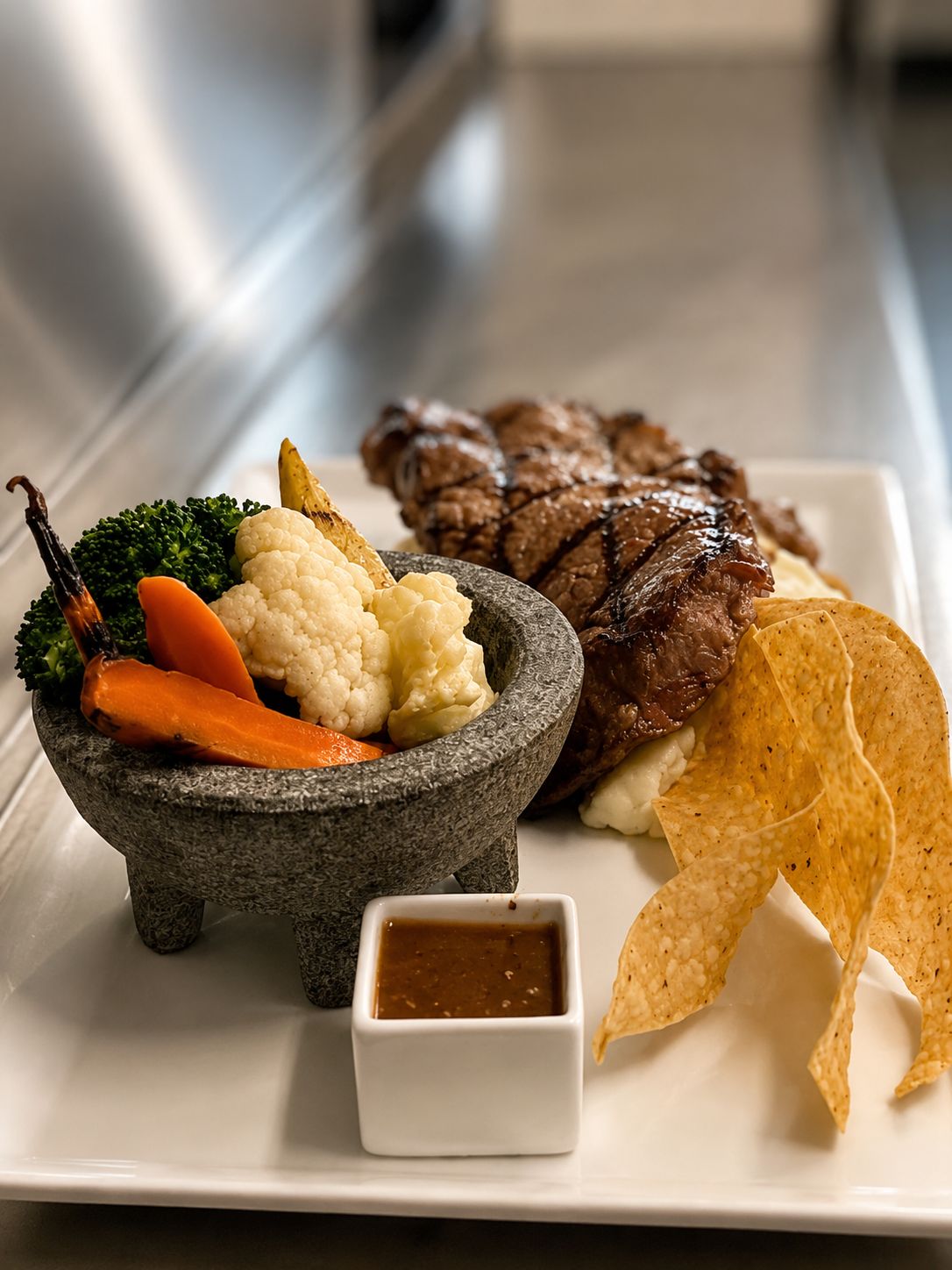 Custom plated main course by Chef Nava