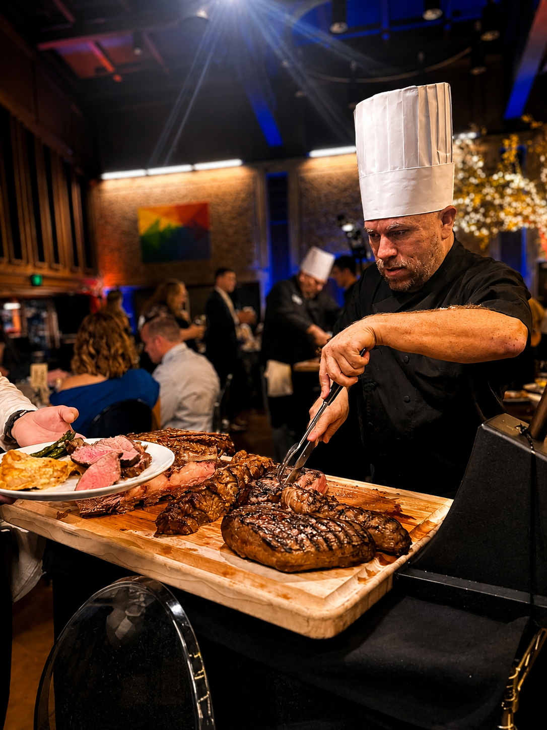 Chef Nava carving and serving cuisine at a live event