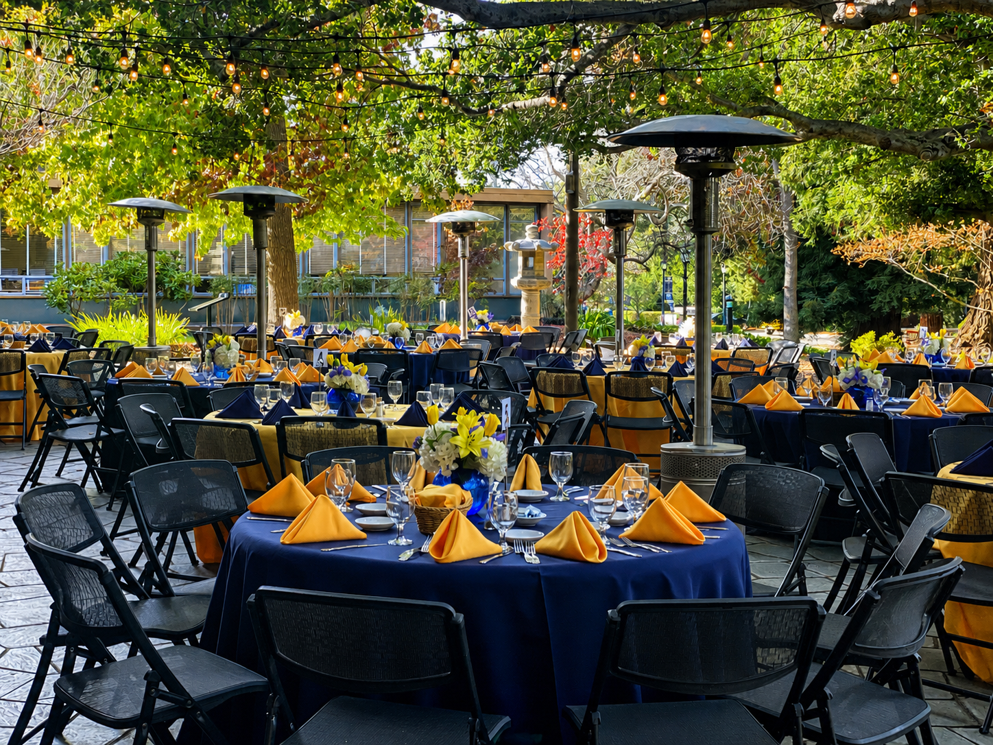 Outdoor event tables set for a Chef Nava celebration